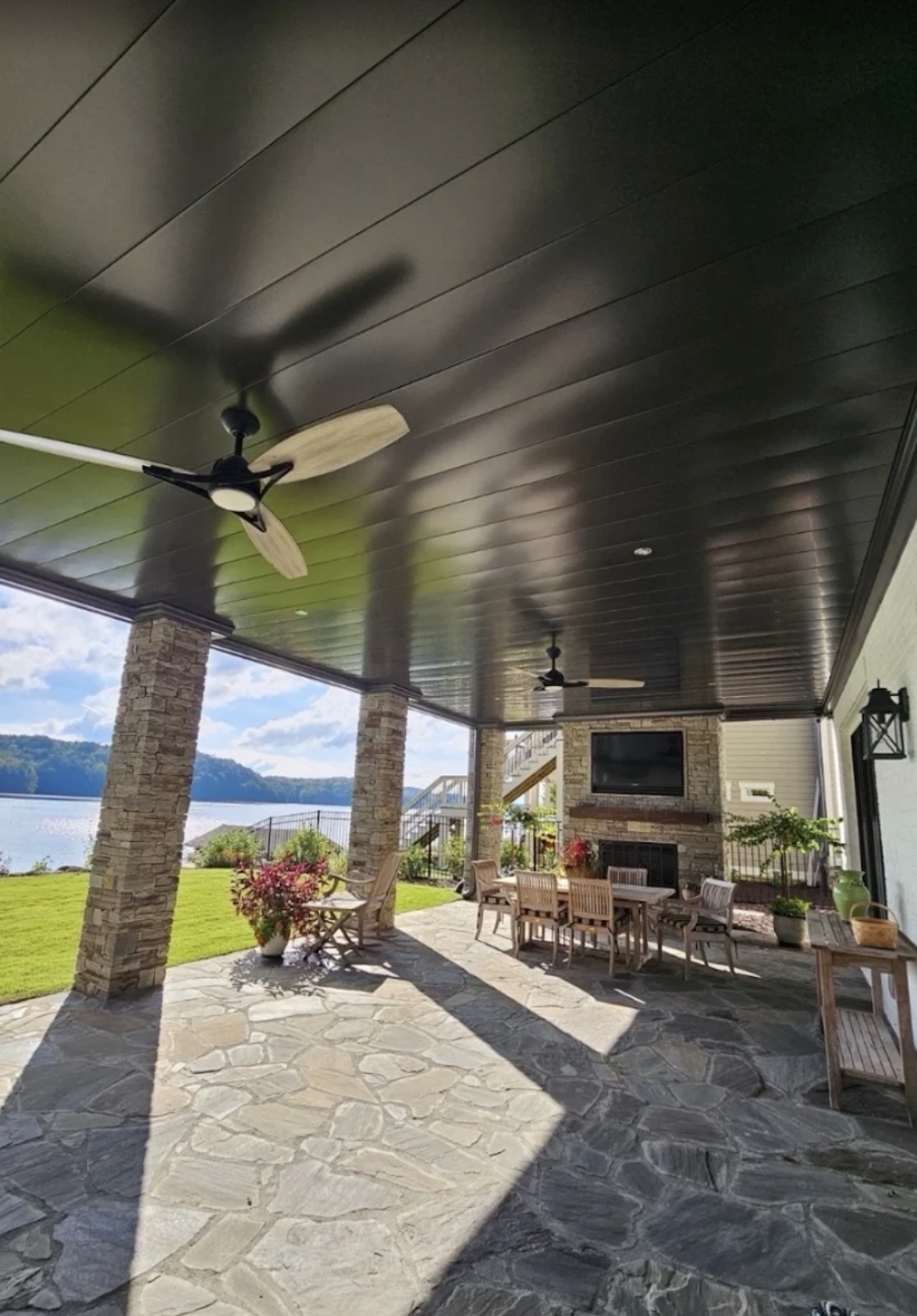 A finished high-end covered outdoor living space overlooking Norris Lake
